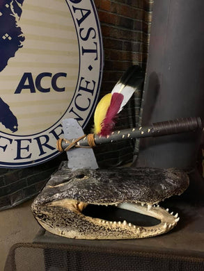 large gator head with hatchet